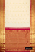 Sandal Dual Tone Kanchipuram Silk Saree with Zari Butta on the body and Zari Border.  displayed on a mannequin