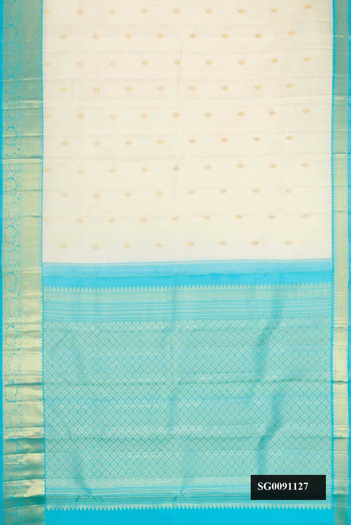 Off White Dual Tone Kanchipuram Silk Saree with Zari Butta on the body and Zari Border.  displayed on a mannequin
