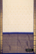 Sandal Dual Tone Kanchipuram Silk Saree with Zari Butta on the body and Zari Border.  displayed on a mannequin