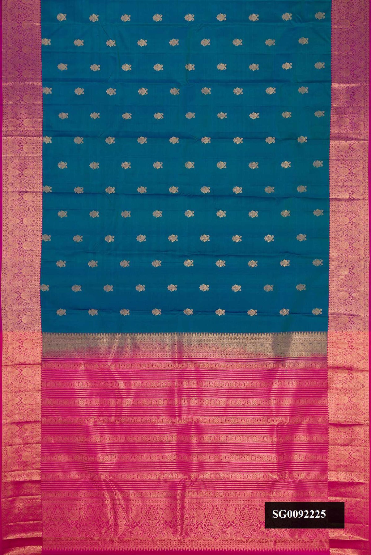 Peacock Blue Dual Tone Kanchipuram Silk Saree with Zari Butta on the body and Zari Border.  displayed on a mannequin