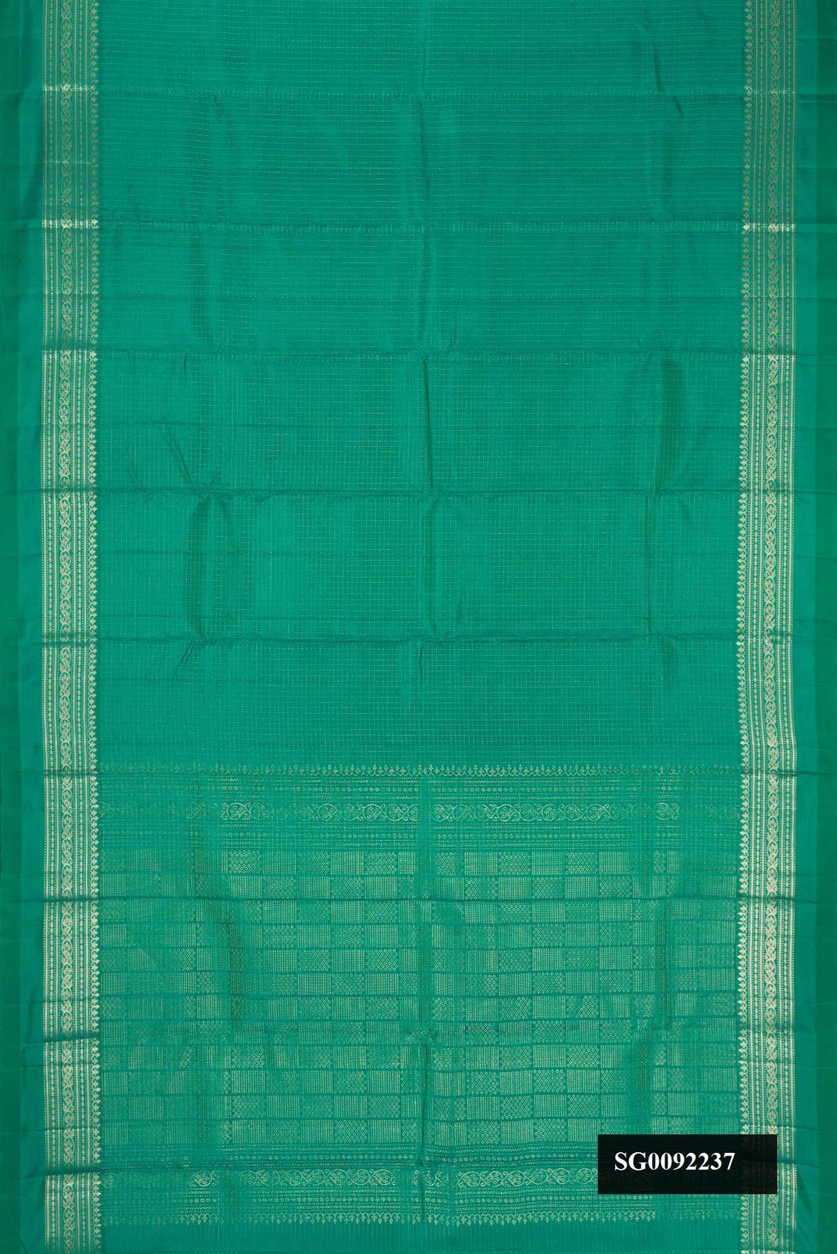 Green Dual Tone Kanchipuram Silk Saree with Checked design on the body and Zari Border.  displayed on a mannequin