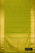 Green Dual Tone Kanchipuram Silk Saree with Zari Butta on the body and Zari Border.  displayed on a mannequin