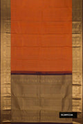 Brick Orange Dual Tone Kanchipuram Silk Saree with Checked design on the body and Zari Border.  displayed on a mannequin