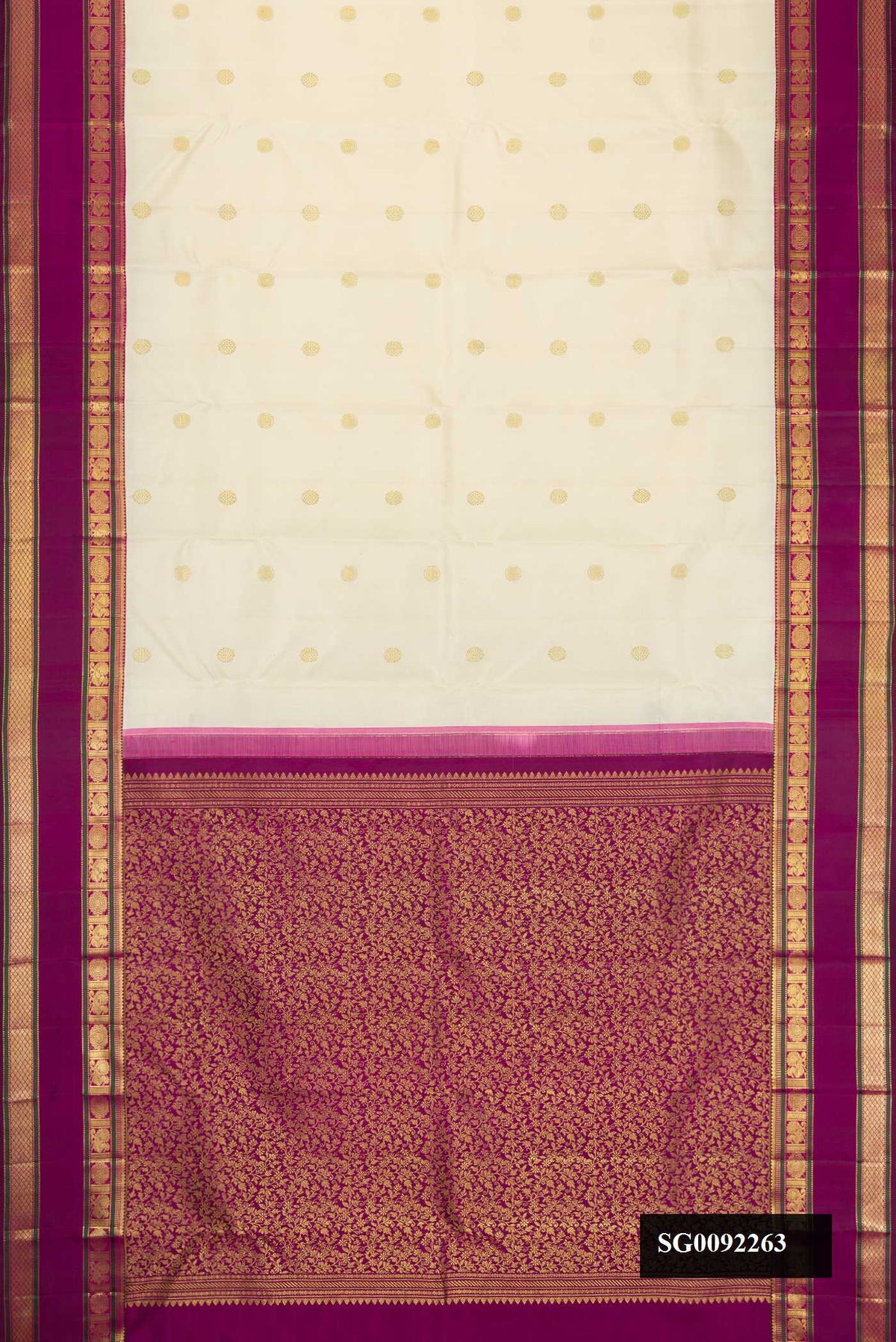 Off White Dual Tone Kanchipuram Silk Saree with Zari Butta on the body and Zari Border.  displayed on a mannequin