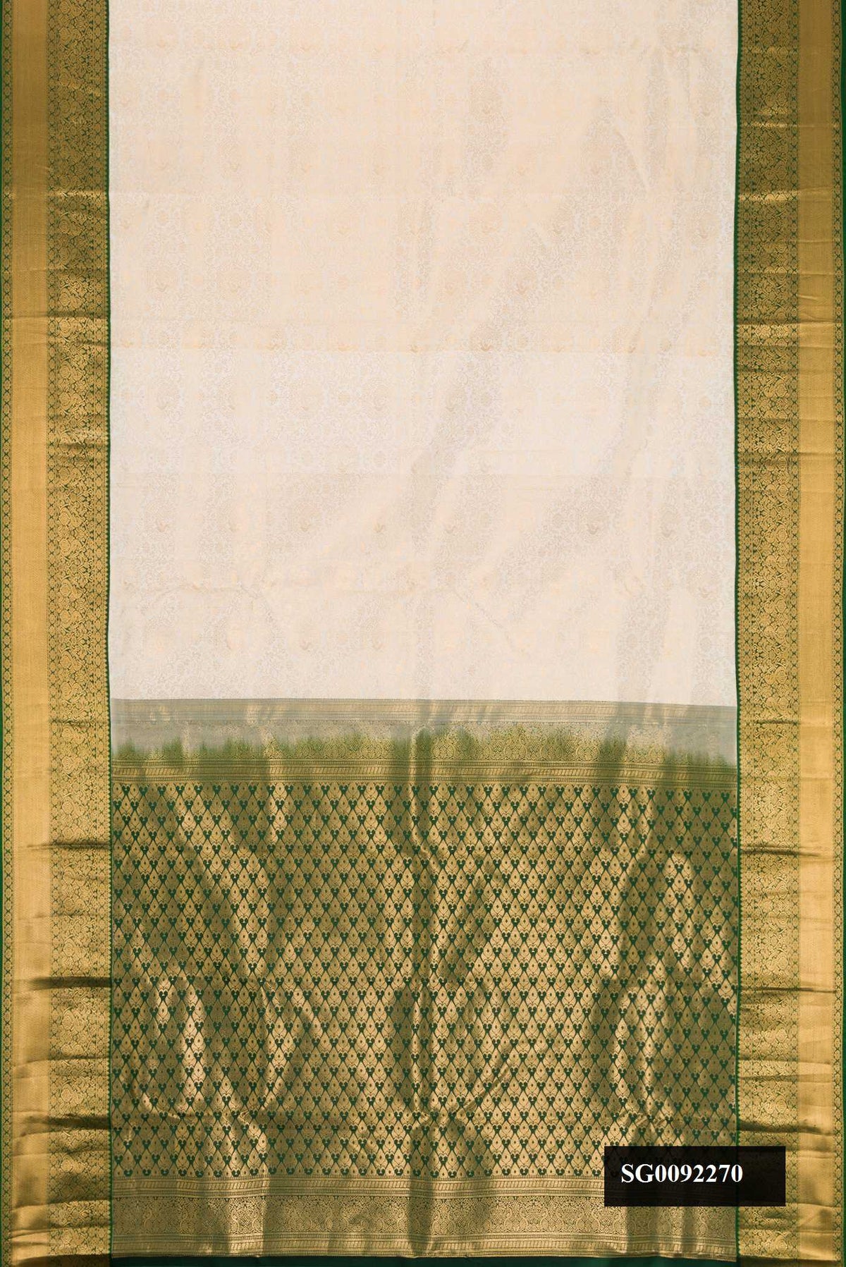 Off White Dual Tone Kanchipuram Silk Saree with Zari Brocade on the body and Zari Border.  displayed on a mannequin