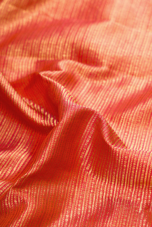Pleats and pallu of Beige Kanchipuram Silk Saree with Zari Butta on the body and Zari Border. 