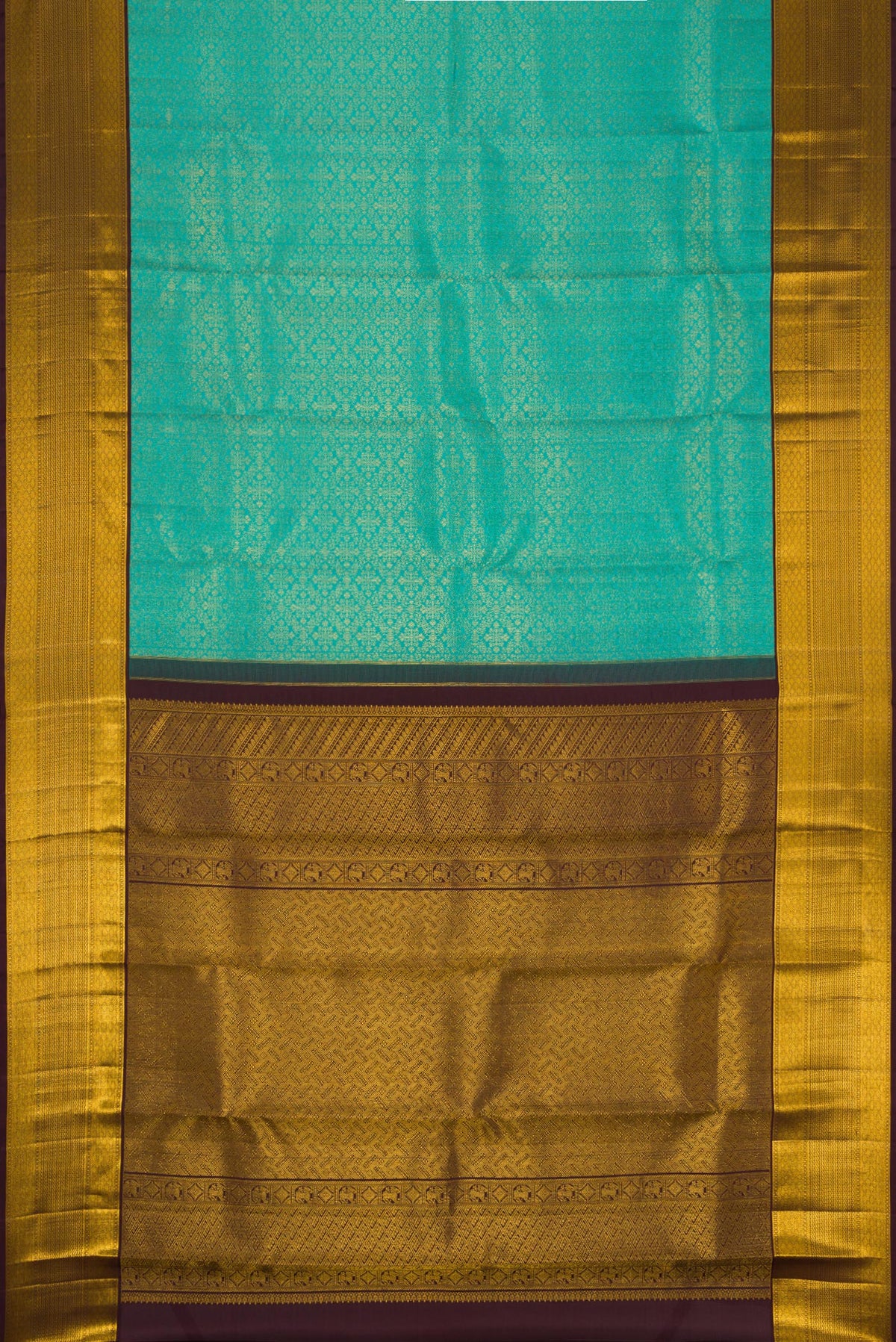 Pleats and pallu of Pure Silk Pure Zari Sandal Kanjivaram Saree with Thread Butta on the body and Zari Border. 