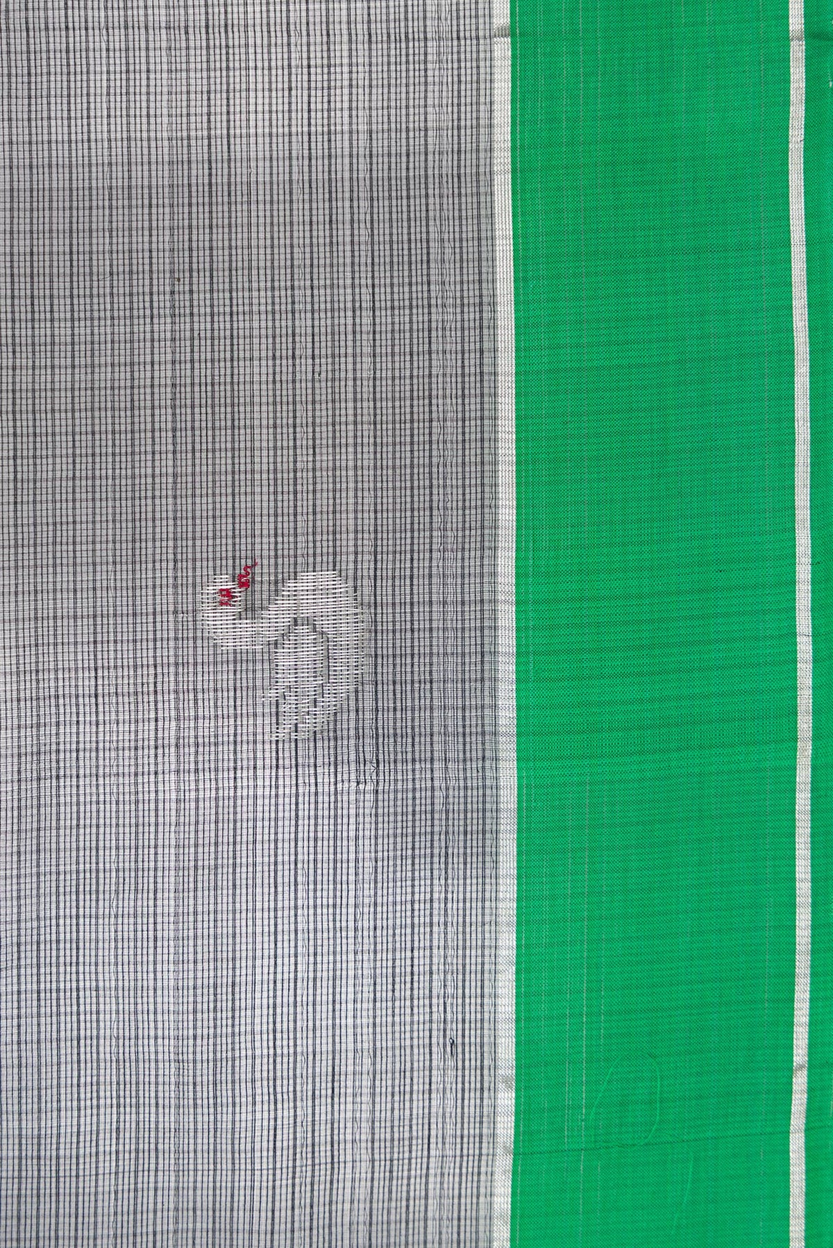 Close up image of the blouse of Peacock Blue Dual Tone Kanjivaram Silk Saree with Zari Brocade on the body and Zari Border. 