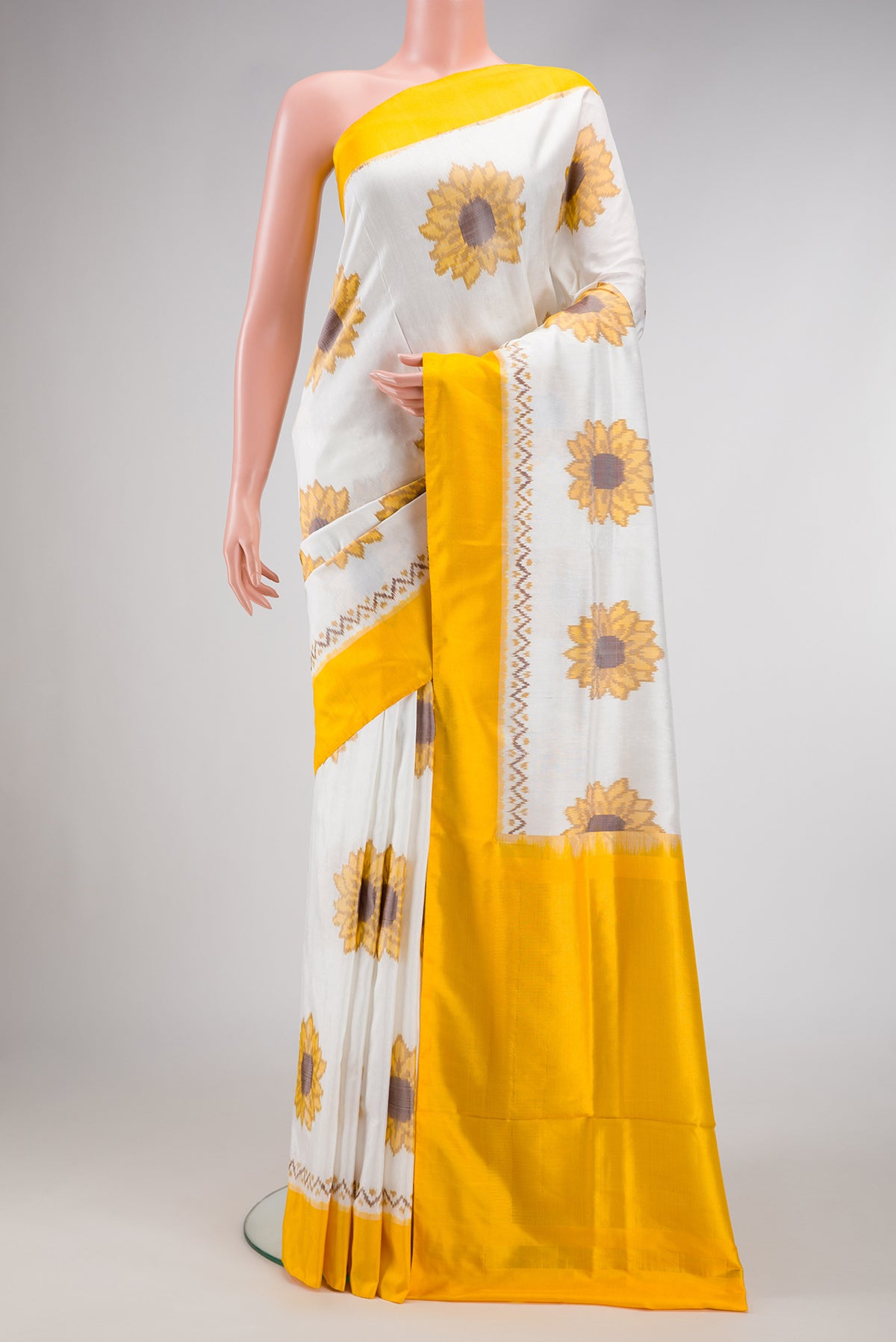 Magenta Soft Silk Saree with Zari Butta on the body and Without Border.  displayed on a mannequin