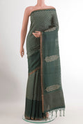 Orange Kanchipuram Silk Saree with Zari Brocade on the body and Zari Border.  displayed on a mannequin