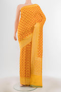Light Green Banarasi Kora Silk Saree with Zari Butta on the body and Zari Border.  displayed on a mannequin