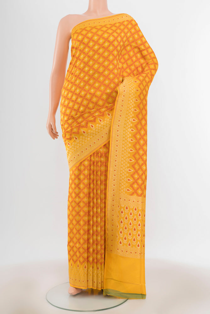 Light Green Banarasi Kora Silk Saree with Zari Butta on the body and Zari Border.  displayed on a mannequin