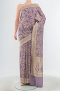 Navy Blue Dual Tone Tissue Silk Saree with Thread Butta on the body and Fancy Border.  displayed on a mannequin