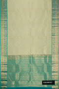 Light Green Dual Tone Kanchipuram Silk Saree with Zari Brocade on the body and Zari Border.  displayed on a mannequin