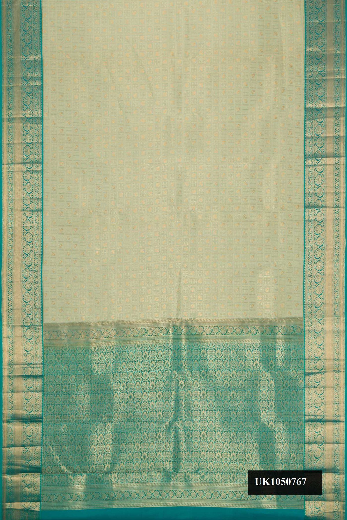Light Green Dual Tone Kanchipuram Silk Saree with Zari Brocade on the body and Zari Border.  displayed on a mannequin