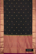 Black Dual Tone Kanchipuram Silk Saree with Zari Butta on the body and Zari Border.  displayed on a mannequin