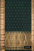 Bottle Green Dual Tone Kanchipuram Silk Saree with Zari Butta on the body and Fancy Border.  displayed on a mannequin