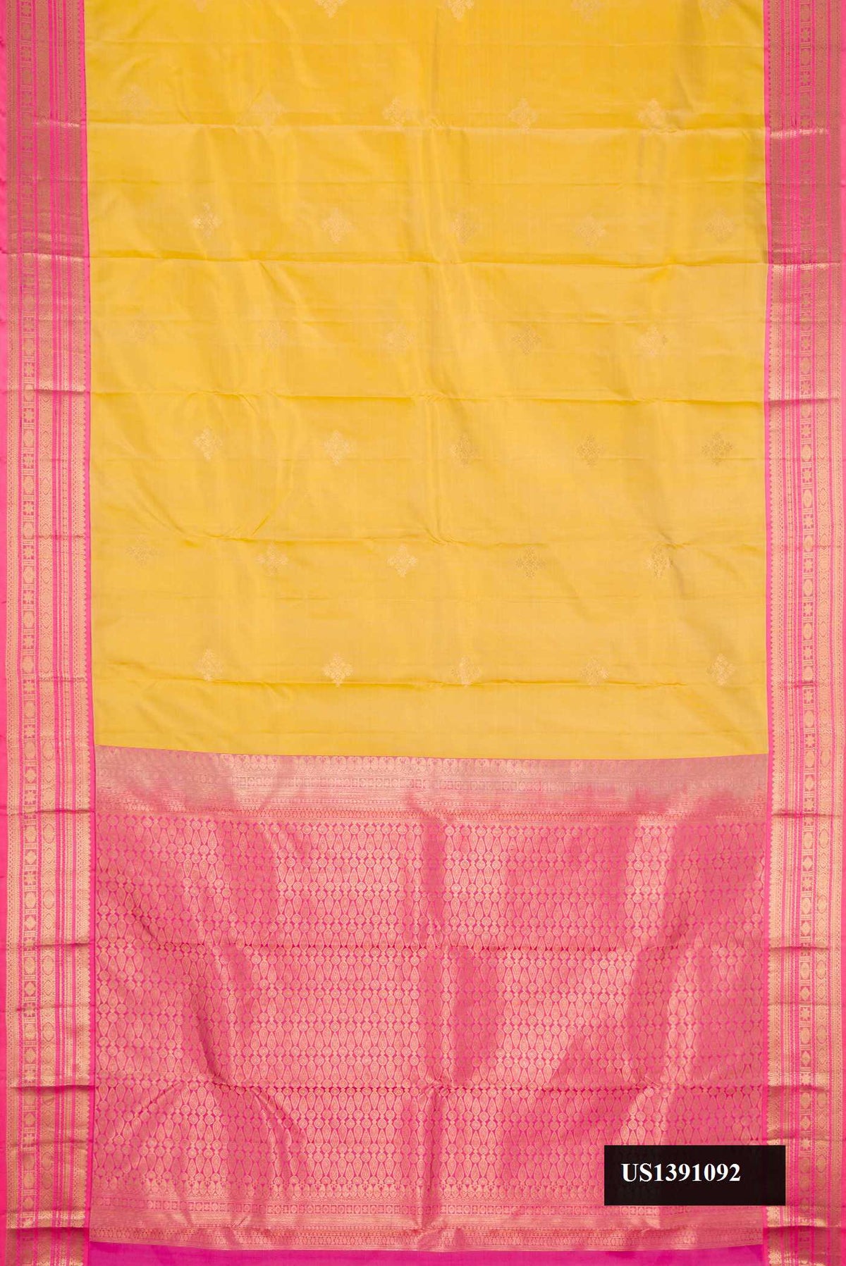 Sandal Dual Tone Kanchipuram Silk Saree with Zari Butta on the body and Zari Border.  displayed on a mannequin