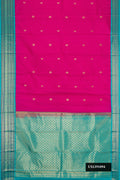 Magenta Dual Tone Kanchipuram Silk Saree with Zari Butta on the body and Zari Border.  displayed on a mannequin
