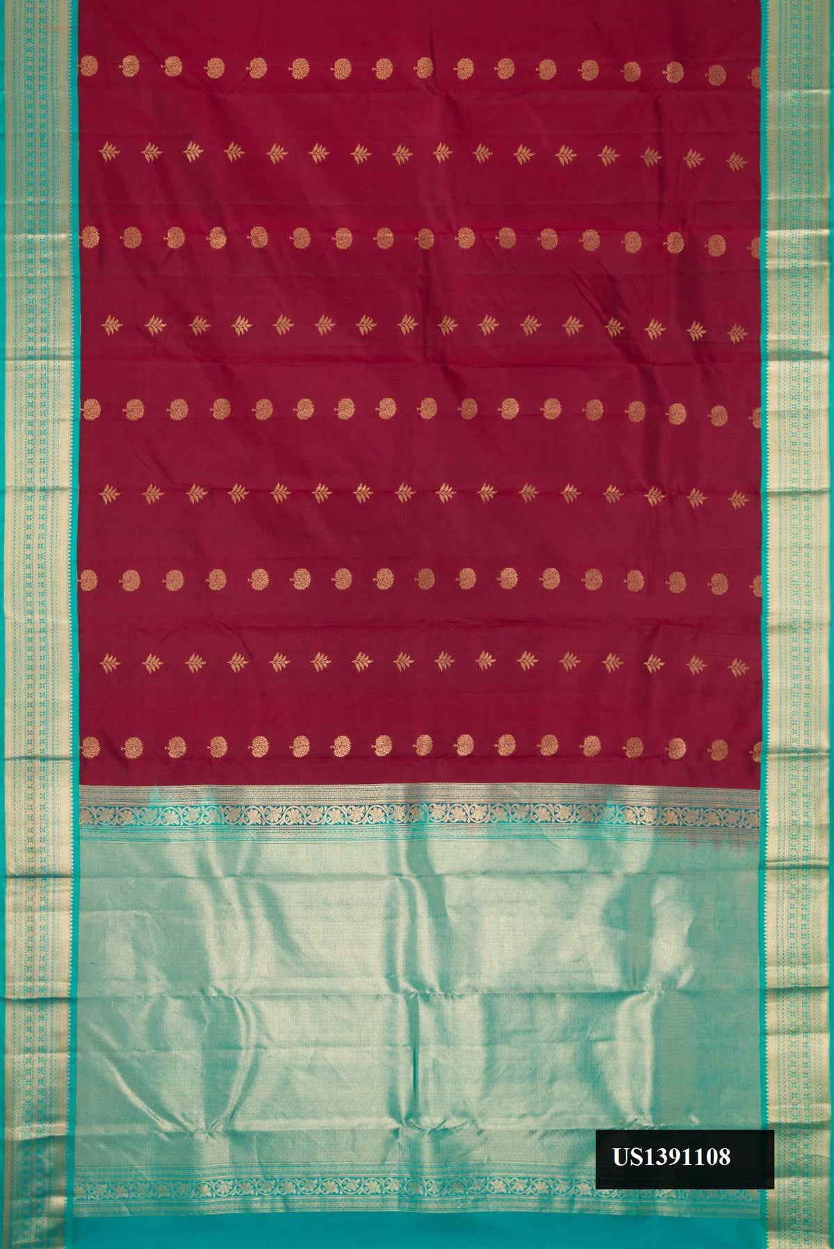 Maroon Dual Tone Kanchipuram Silk Saree with Zari Butta on the body and Zari Border.  displayed on a mannequin