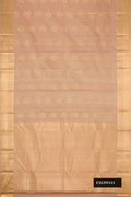 Beige Dual Tone Kanchipuram Silk Saree with Zari Butta on the body and Zari Border.  displayed on a mannequin