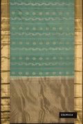 Green Dual Tone Kanchipuram Silk Saree with Stripes on the body and Zari Border.  displayed on a mannequin