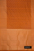 Brick Orange Dual Tone Kanchipuram Silk Saree with Zari Butta on the body and Zari Border.  displayed on a mannequin