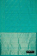 Green Dual Tone Kanchipuram Silk Saree with Zari Butta on the body and Zari Border.  displayed on a mannequin