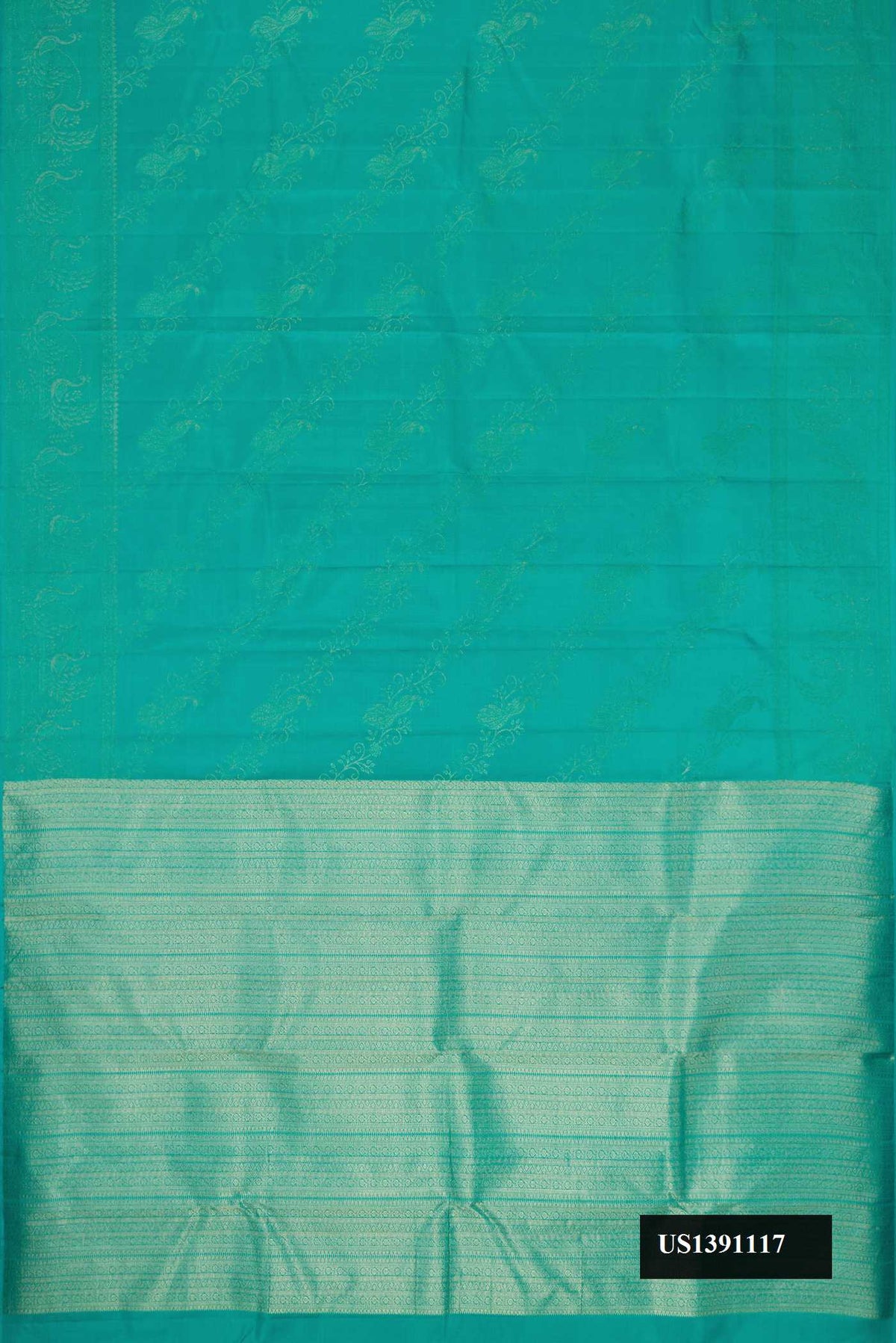 Green Dual Tone Kanchipuram Silk Saree with Zari Butta on the body and Zari Border.  displayed on a mannequin