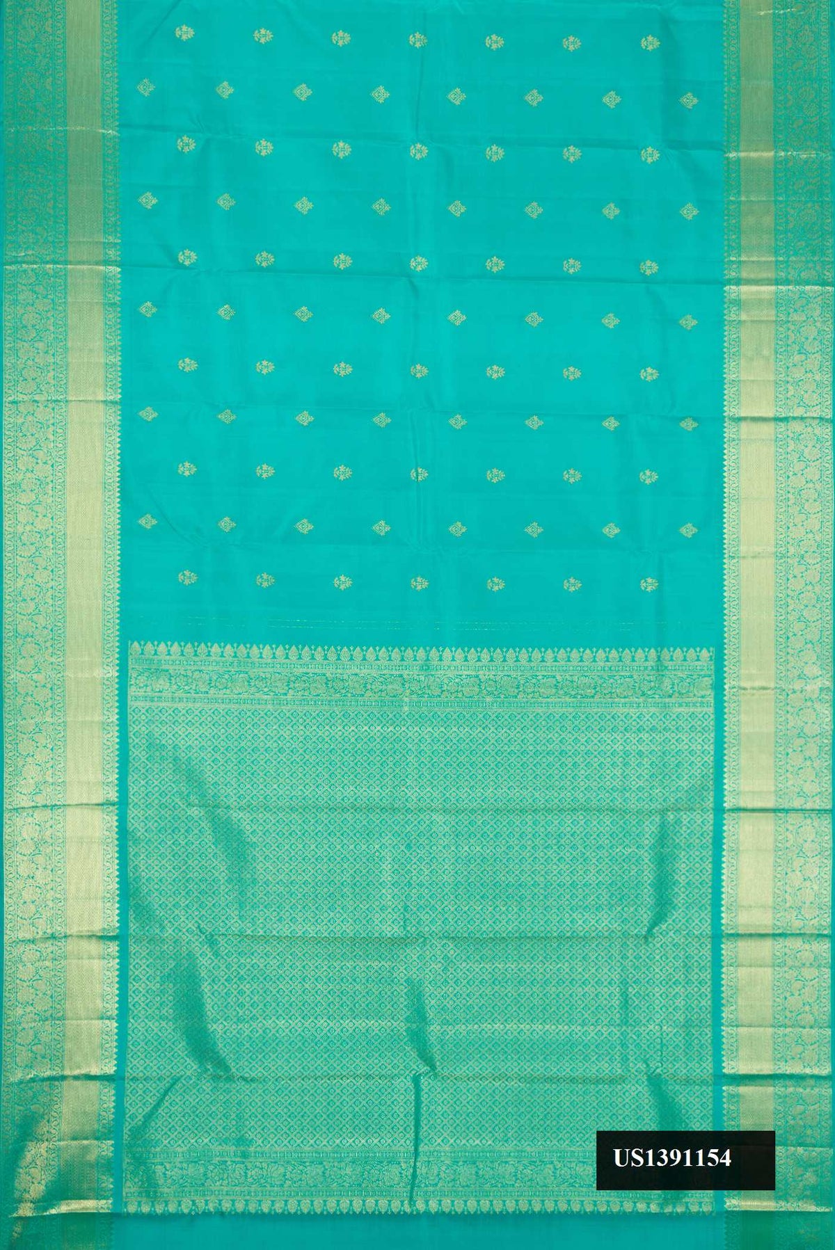 Green Dual Tone Kanchipuram Silk Saree with Zari Butta on the body and Zari Border.  displayed on a mannequin