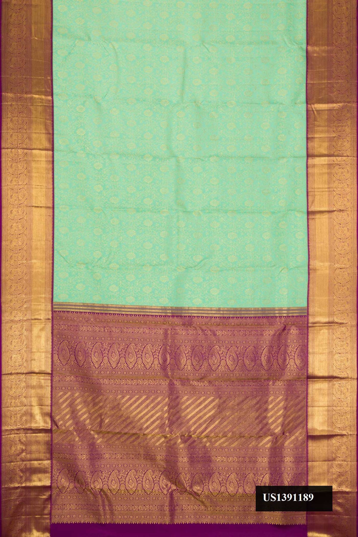 Sea Green Dual Tone Kanchipuram Silk Saree with Zari Brocade on the body and Zari Border.  displayed on a mannequin
