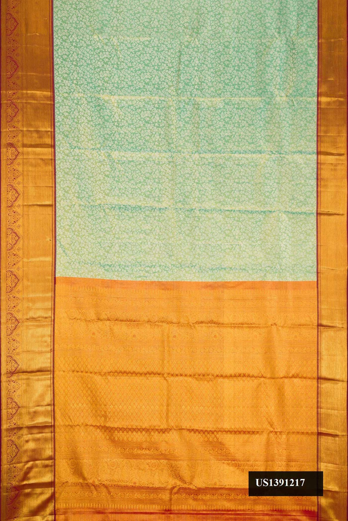 Sea Green Dual Tone Kanchipuram Tissue Silk Saree with Zari Brocade on the body and Fancy Border.  displayed on a mannequin