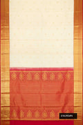 Sandal Dual Tone Kanchipuram Silk Saree with Zari Butta on the body and Zari Border.  displayed on a mannequin