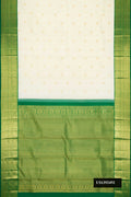 Sandal Dual Tone Kanchipuram Silk Saree with Zari Butta on the body and Zari Border.  displayed on a mannequin