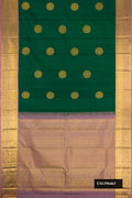 Green Dual Tone Kanchipuram Silk Saree with Zari Butta on the body and Zari Border.  displayed on a mannequin