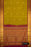 Mehandi Green Dual Tone Kanchipuram Silk Saree with Zari Butta on the body and Zari Border.  displayed on a mannequin