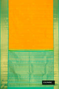 Mustard Dual Tone Kanchipuram Silk Saree with Zari Butta on the body and Zari Border.  displayed on a mannequin