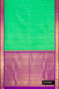 Green Dual Tone Kanchipuram Silk Saree with Zari Butta on the body and Zari Border.  displayed on a mannequin