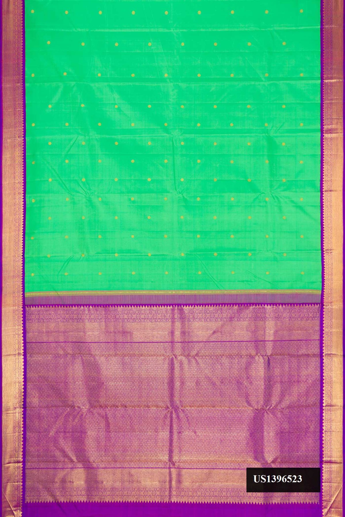 Green Dual Tone Kanchipuram Silk Saree with Zari Butta on the body and Zari Border.  displayed on a mannequin