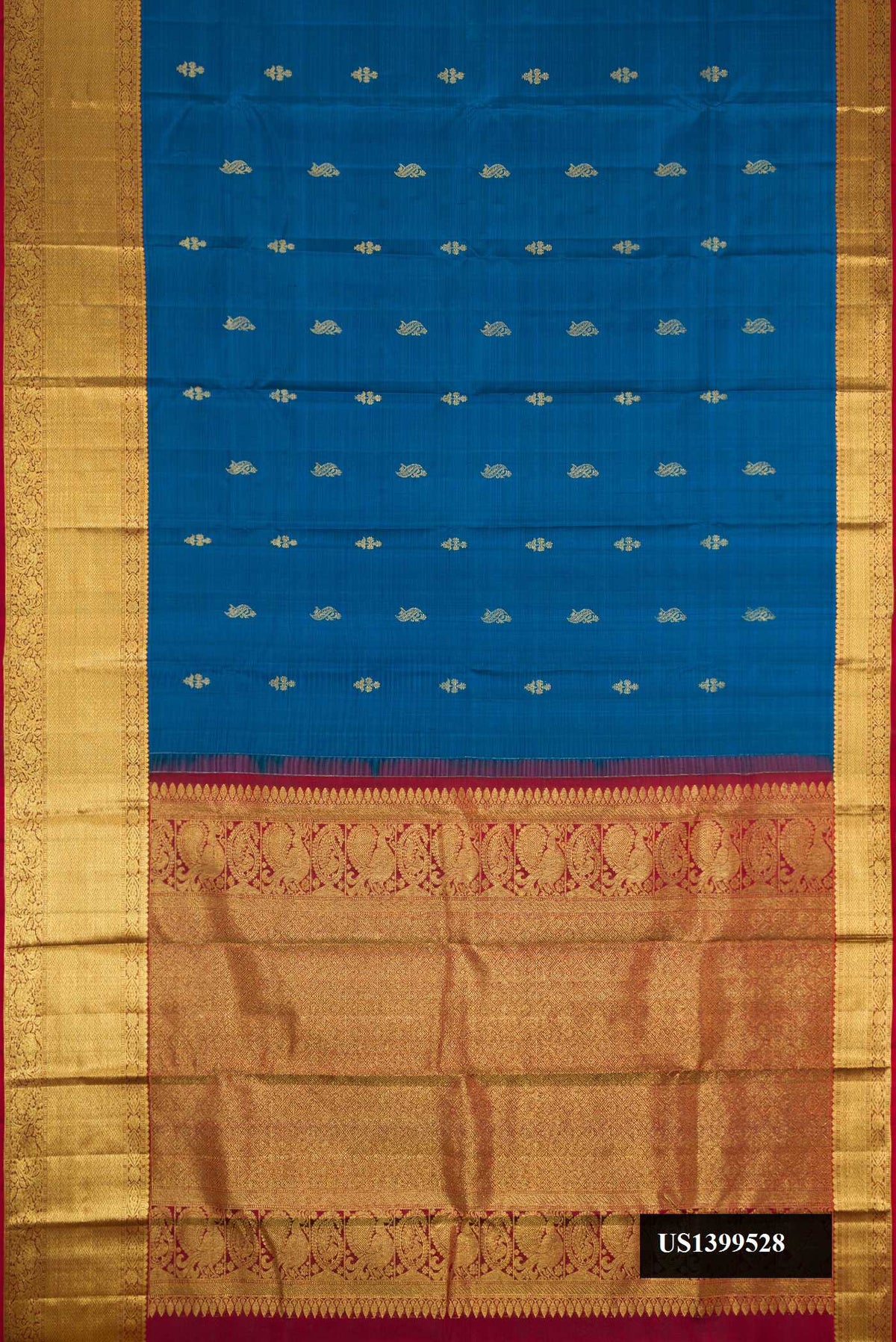 Peacock Blue Dual Tone Kanchipuram Silk Saree with Zari Butta on the body and Zari Border.  displayed on a mannequin
