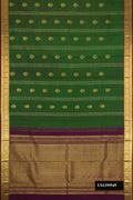 Green Dual Tone Kanchipuram Silk Saree with Zari Butta on the body and Zari Border.  displayed on a mannequin