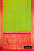 Parrot Green Dual Tone Kanchipuram Silk Saree with Zari Butta on the body and Zari Border.  displayed on a mannequin