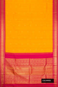 Mustard Dual Tone Kanchipuram Silk Saree with Zari Butta on the body and Zari Border.  displayed on a mannequin