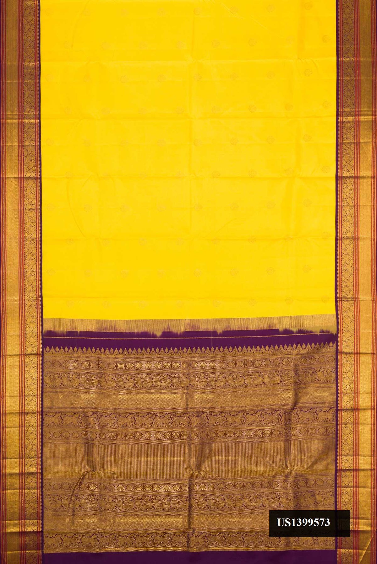 Yellow Dual Tone Kanchipuram Silk Saree with Zari Butta on the body and Zari Border.  displayed on a mannequin