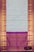Grey Dual Tone Kanchipuram Silk Saree with Zari Butta on the body and Zari Border.  displayed on a mannequin