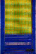 Parrot Green and Yellow Dual Tone Kanchipuram Silk Saree with Checked design on the body and Zari Border.  displayed on a mannequin