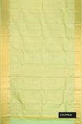Light Green Dual Tone Kanchipuram Silk Saree with Zari Brocade on the body and Zari Border.  displayed on a mannequin