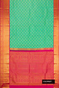 Green Dual Tone Kanchipuram Silk Saree with Zari Brocade on the body and Zari Border.  displayed on a mannequin