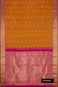 Mustard Dual Tone Kanchipuram Silk Saree with Stripes on the body and Zari Border.  displayed on a mannequin