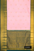 Rose Gold Dual Tone Kanchipuram Silk Saree with Zari Butta on the body and Zari Border.  displayed on a mannequin
